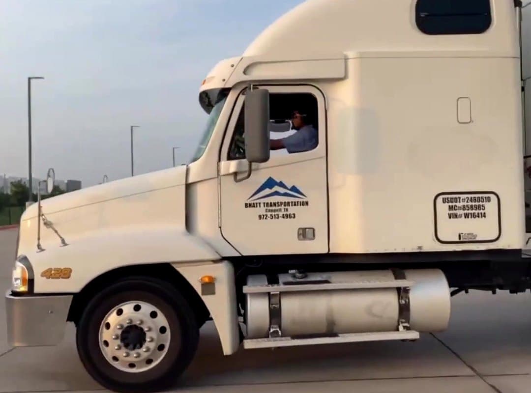 A Bhatt Transportation driver at the wheel of a company tractor in Coppell, Texas